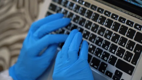 Top view physician man hands using laptop, working remote close up. Distancing. Stock Footage 128553920