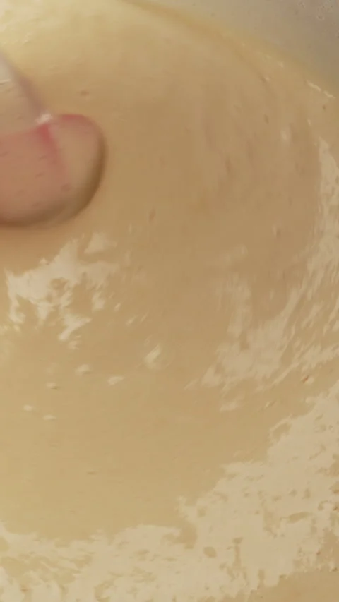 Top view. Pie dough is mixed with silicone spatula. Process of making homem.. Stock Footage 338397465