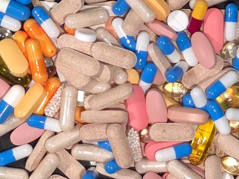 Top view of a pile of assorted pills, tablets, and capsules Stock Photos