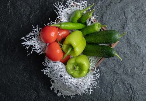 Top view of Pile of fresh vegetables in wooden basket Stock Photos