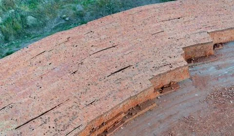 Top view of pile of red bricks lined up in row in a brick plant Stock Photos