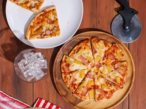 Top view pineapple and ham hawaiian pizza and chicken and sausage pizza on .. Stock Photos