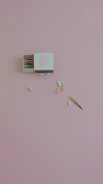 Top view of pink and mint hearts spilled alongside burnt matches Stock Illustration