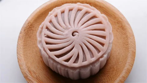 Top view pink modern moon cake rotating close up Stock Footage 94414560