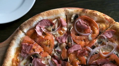Top view of pizza with hands taking slices, slow motion Stock Footage 124792940