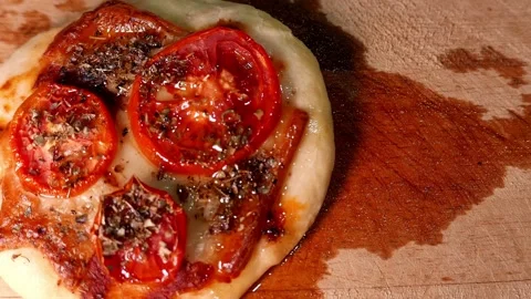 Top View: pizzaiolo pouring olive oil over a pizza: Tomato, mozzarella, oregano Stock Footage 345122855