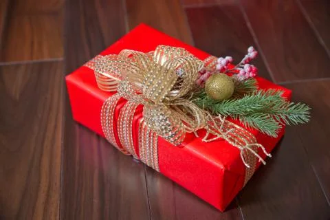 Top view with place for text . Red gift box on wooden background . Gift box o Stock Photos