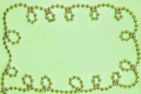 Top view plain background with beads ornament on the sides. flatlay copyspace Stock Photos