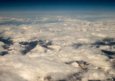 Top View from plane to snow capped peaks of Caucasus Mountains Stock Photos