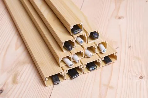 Top view of plastic cable ducts with neatly arranged electric wires stacked.. Stock Photos