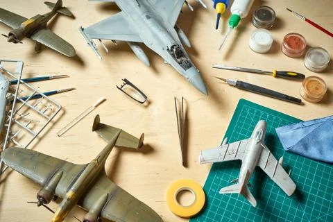 Top view on plastic model scale with accessories on  green pad on  wooden table Stock Photos