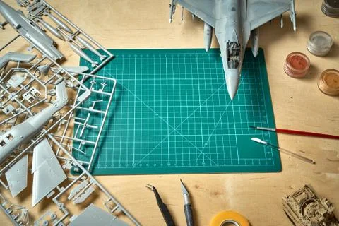 Top view on plastic model scale with accessories on  green pad on  wooden table Stock Photos