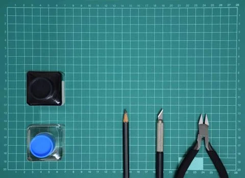 Top view Plastic model tool kit ink, art knife, cutting pliers on Cutting mat Stock Photos