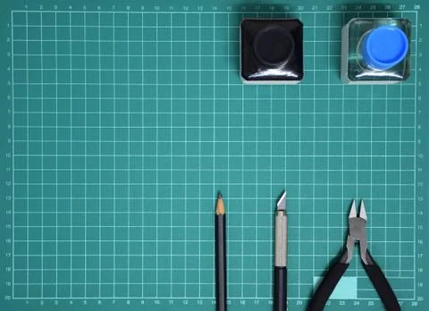 Top view Plastic model tool kit ink, art knife, cutting pliers on Cutting mat Stock Photos