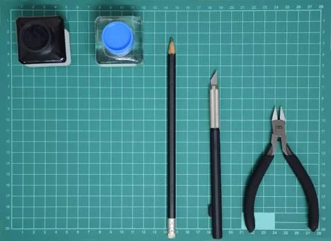Top view Plastic model tool kit ink, art knife, cutting pliers on Cutting mat Stock Photos