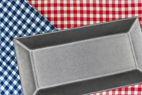 Top view plate on checkered tablecloth pattern background 스톡 사진