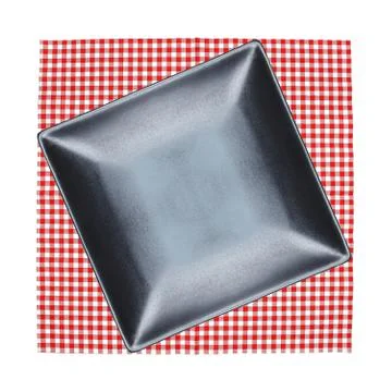 Top view plate on checkered tablecloth pattern background Stock Photos