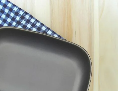 Top view plate on checkered tablecloth pattern background Stock Photos