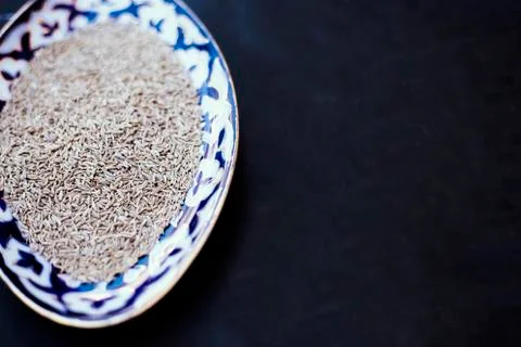 Top view of plate with cumin Stock Photos