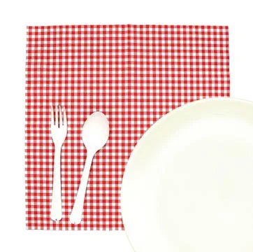 Top view plate with fork and spoon on tablecloth for food serving background 写真素材