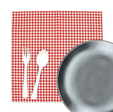 Top view plate with fork and spoon on tablecloth for food serving background 写真素材