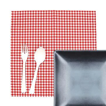 Top view plate with fork and spoon on tablecloth for food serving background Stock Photos