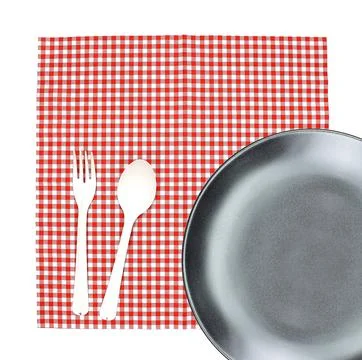 Top view plate with fork and spoon on tablecloth for food serving background Stock Photos
