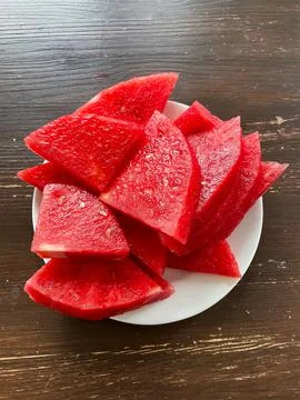 Top view of plate with sliced seedless watermelon Stock Photos