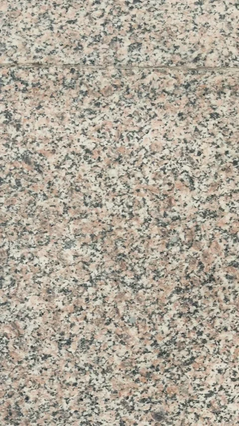 Top view of polished pink granite floor tiles with a natural stone speckled.. Stock Footage 337788585