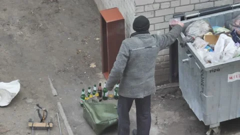 Top view of poor man finds a food the garbage can Stock Footage 121446155