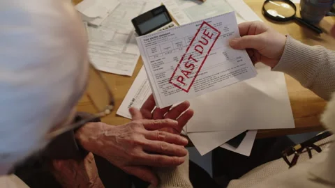 Top View of Poor Retired Couple Taking out Overdue Bill from Envelope Stock Footage 277508213