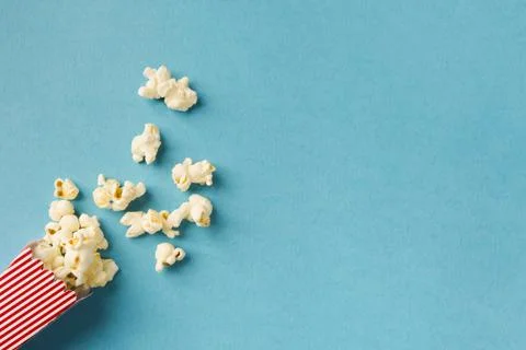 Top view popcorn composition blue background with copy space. High quality and Stock Photos