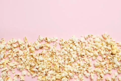 Top view of popcorn pattern on pink background. Cinema, movies and entertainm Stock Photos