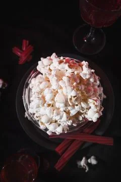 Top View of Popcorn, Red Drinks, and Licorice for a Movie Night Stock Photos