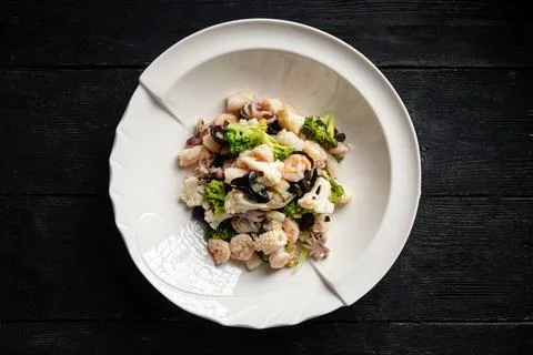 Top view on portion of assorted seafood dish Stock Photos