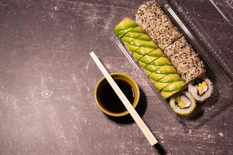 Top view of a portion of sushi in a plastic container Stock Photos