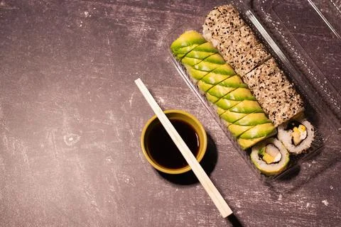 Top view of a portion of sushi in a plastic container Stock Photos