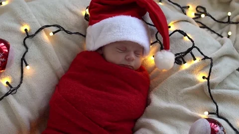 Top View Portrait First Days Of Life Newborn Cute Funny Sleeping Baby In Santa Stock Footage 161436894