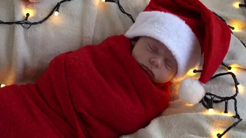 Top View Portrait First Days Of Life Newborn Cute Funny Sleeping Baby In Santa Stock Footage 163062884
