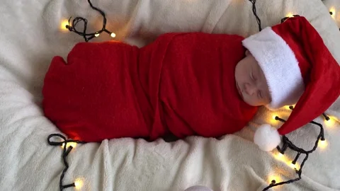 Top View Portrait First Days Of Life Newborn Cute Funny Sleeping Baby In Santa Stock Footage 164291128