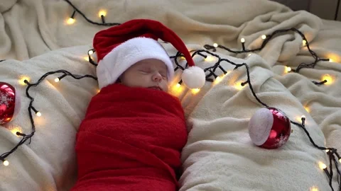 Top View Portrait First Days Of Life Newborn Cute Funny Sleeping Baby In Santa Stock Footage 164589911