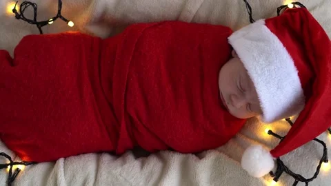 Top View Portrait First Days Of Life Newborn Cute Funny Sleeping Baby In Santa Stock Footage 164650796
