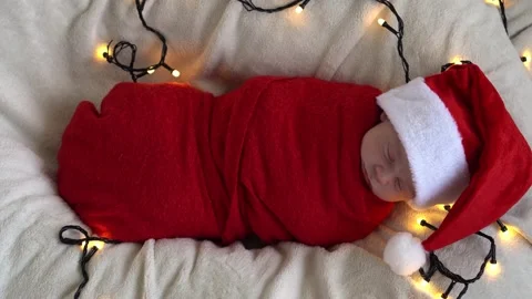 Top View Portrait First Days Of Life Newborn Cute Funny Sleeping Baby In Santa Stock Footage 203839660
