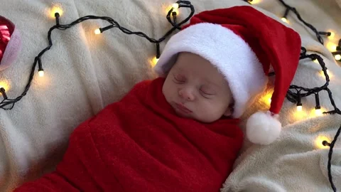 Top View Portrait First Days Of Life Newborn Cute Funny Sleeping Baby In Santa Stock Footage 232778702