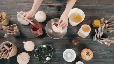 Top view potter making ceramic bowls and plates, woman hands painting color Stock Footage 145030316