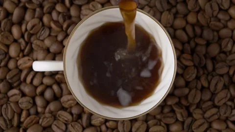 Top view of pouring black coffee into a small cup 库存影片 295074444