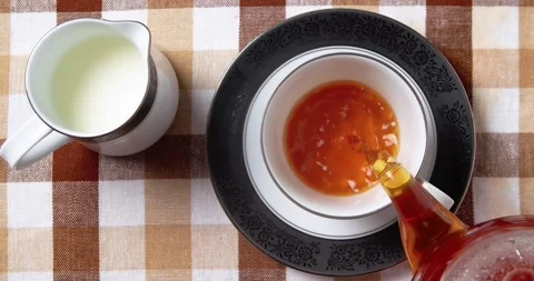Top view Pouring black tea in cup. Stock Footage 238649239
