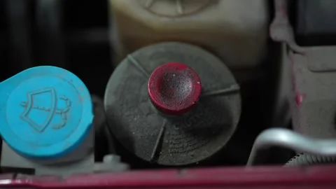 Top view of power steering and windshield washer fluid caps. Stock Footage 345708649