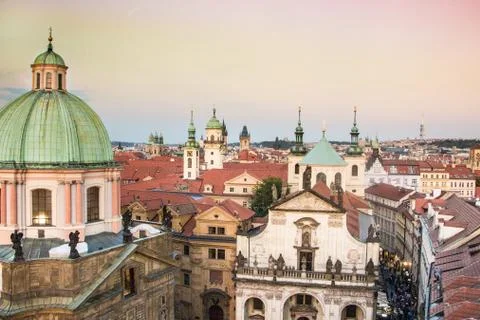 Top view at Prague's rooftops and its many towers lit by sunset Stock Photos