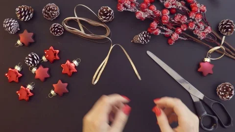 Top view preparing Christmas decoration on the table hands from above. Stock Footage 70007857